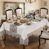 Wholesale luxury white lace tablecloth with premium guipure border on formal dining table setup